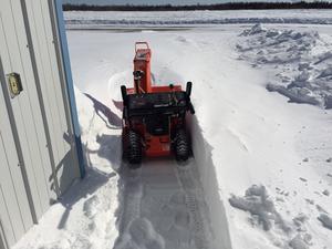 Deep snow on the way from the side door to the front of the hangar