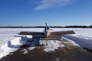 Not much clearance between snowbanks and the bottom of the wings