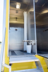 Individual shower stall with change area by door