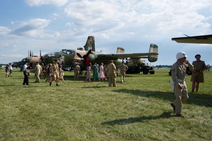 B-25 with a large contingent of people dressed in period uniforms