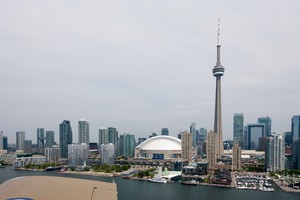 CN Tower, Sky Dome and condos close by the right side during final approach to runway 24